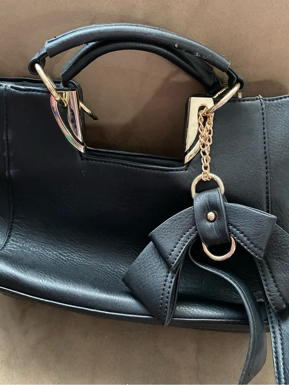 Black Bow Charm Wristlet Clutch with Gold Accents